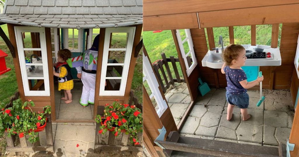 toddlers playing outside in playhouse